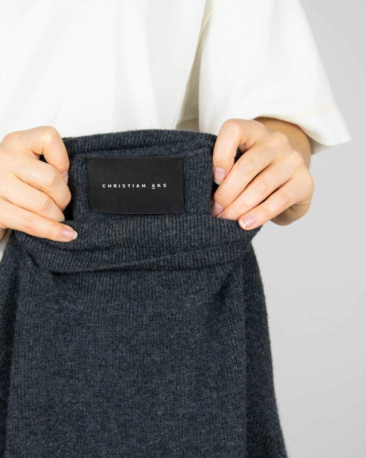 Charcoal grey merino wool turtleneck sweater by Norwegian premium brand Christian AKS / AKS LABEL.