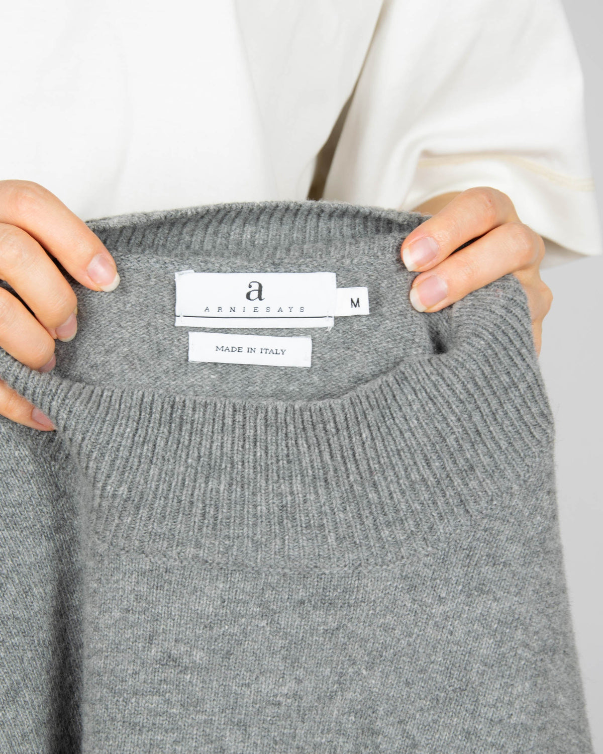 Grey wool turtleneck sweater by premium brand Arnie Says. Made in Italy.