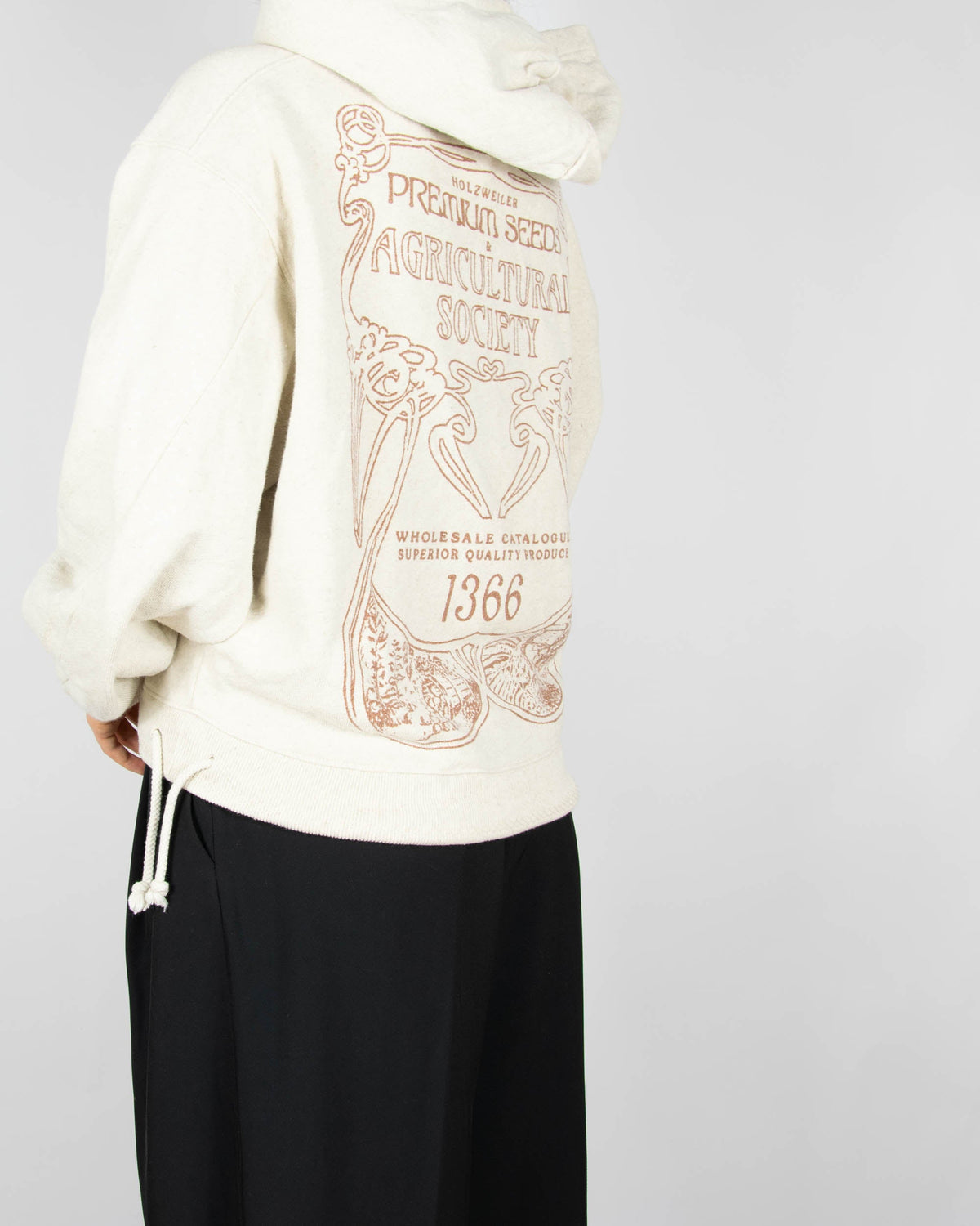 Beige hoodie made from organic cotton and hemp by Norwegian designer brand Holzweiler. The regular price is 3500 NOK (~1370 PLN). Made in Portugal.