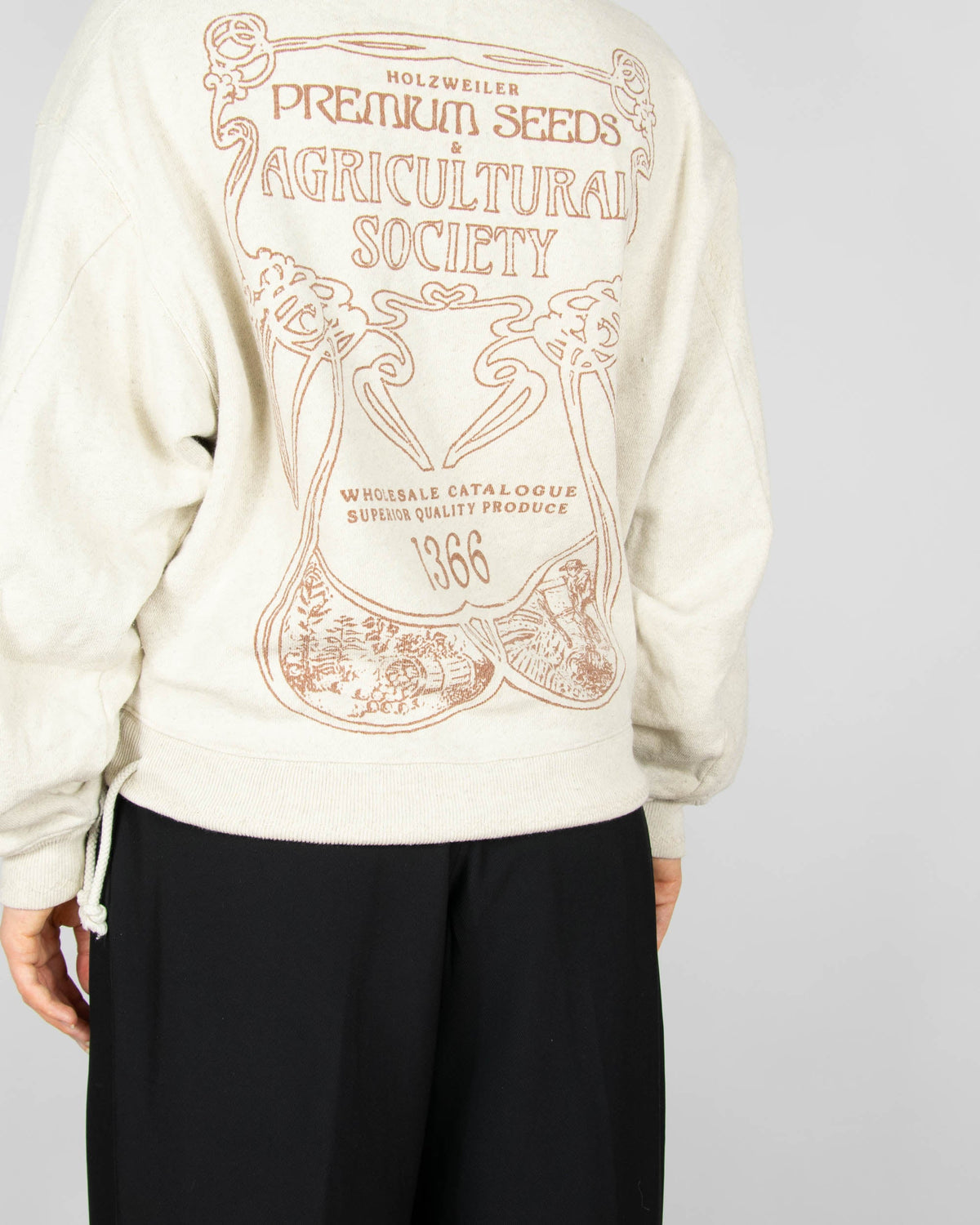 Beige hoodie made from organic cotton and hemp by Norwegian designer brand Holzweiler. The regular price is 3500 NOK (~1370 PLN). Made in Portugal.