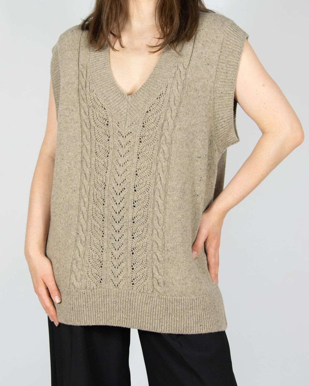 Beige open-knit wool vest by premium brand Baukjen