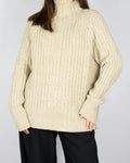 Beige chunky wool and cashmere turtleneck sweater by premium brand Ralph Lauren.