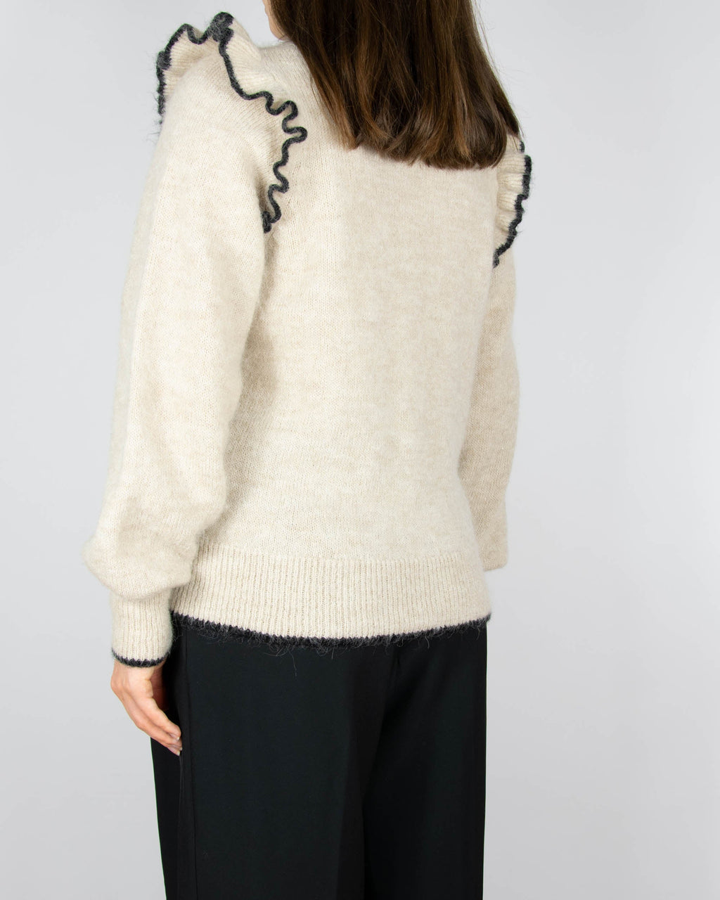 Beige wool and alpaca sweater with ruffle details by Scandinavian brand Selected.