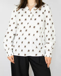 White organic cotton blouse with horse prints by Scandinavian premium brand MUNTHE