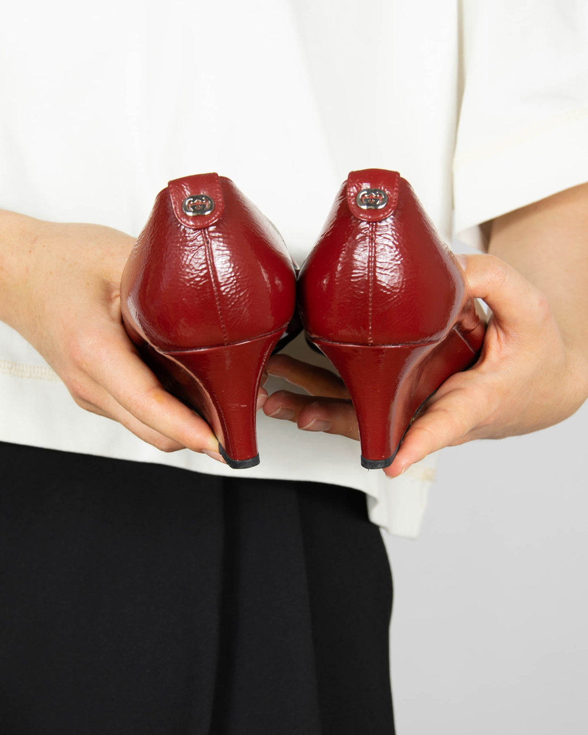 Red leather wedge pumps by Gucci