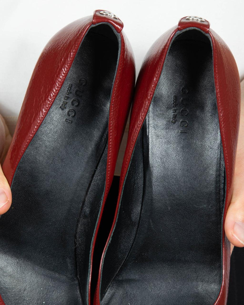Red leather wedge pumps by Gucci