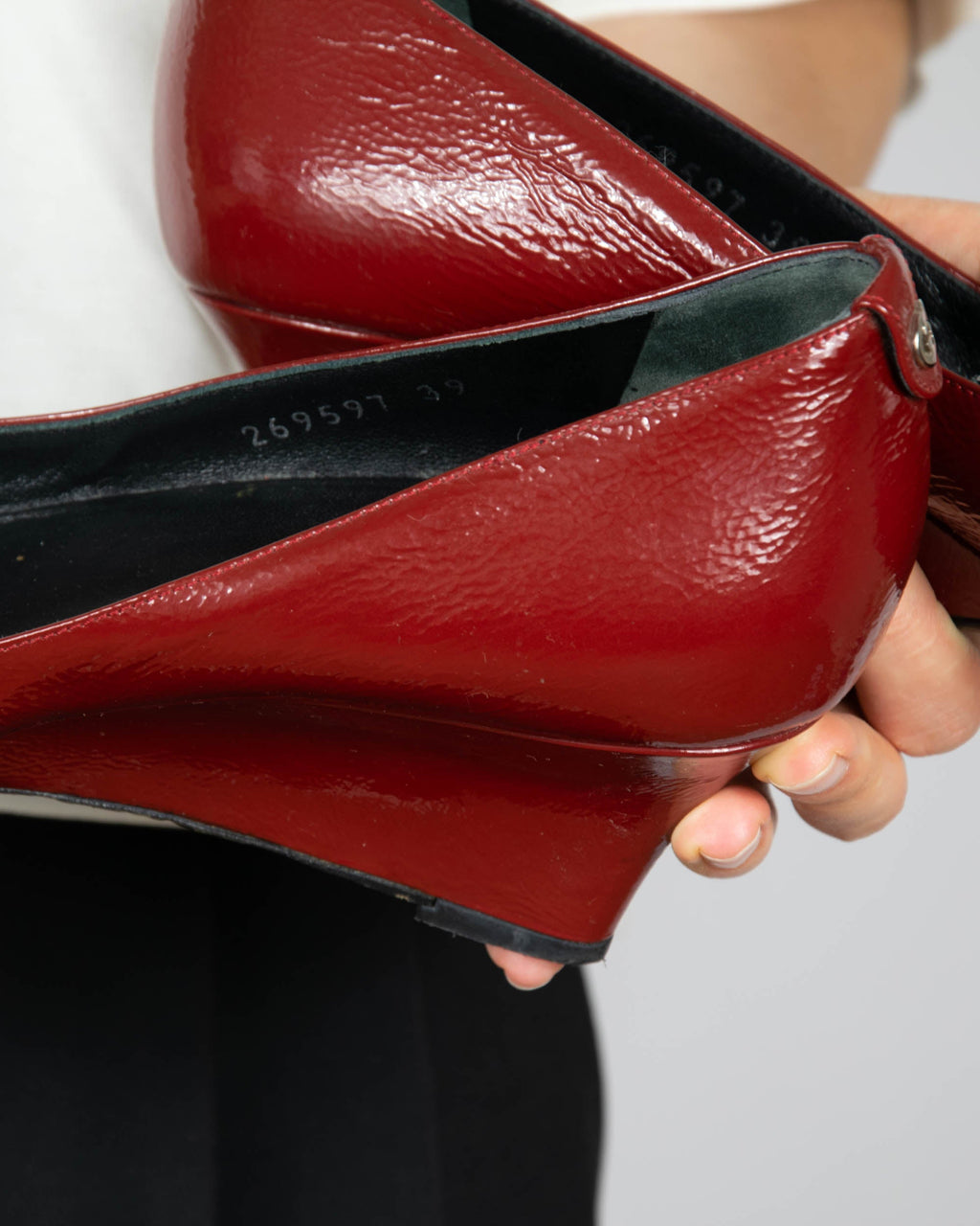 Red leather wedge pumps by Gucci