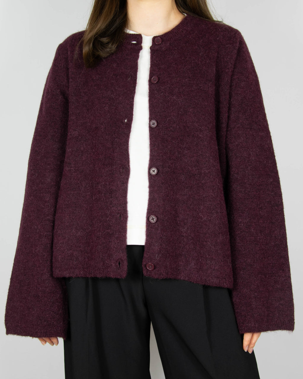 Burgundy wool and alpaca cardigan by Scandinavian brand Selected. The price on the tag is 330 PLN.