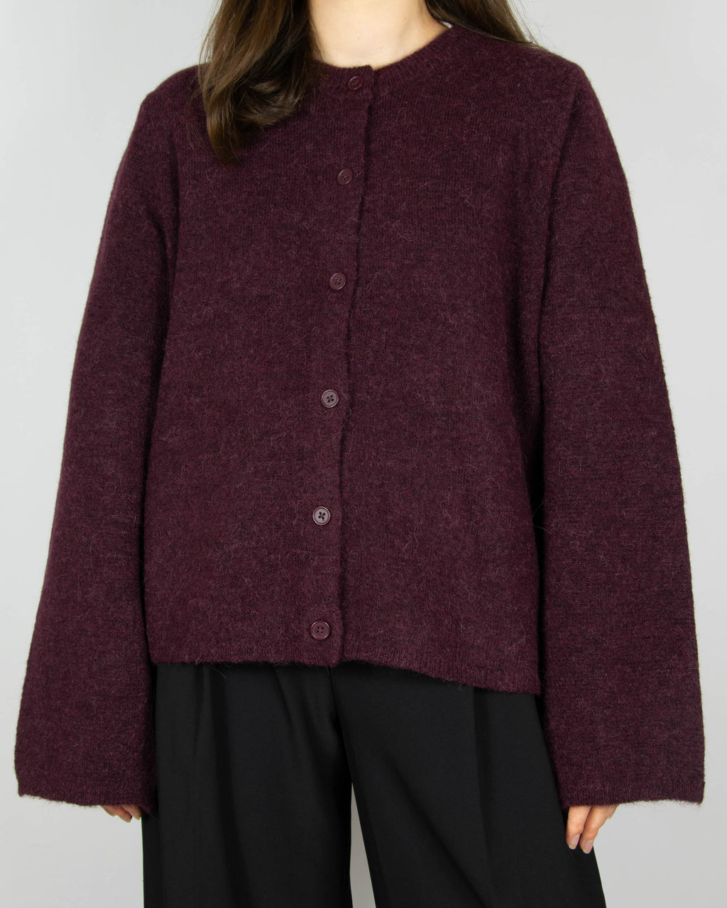 Burgundy wool and alpaca cardigan by Scandinavian brand Selected. The price on the tag is 330 PLN.
