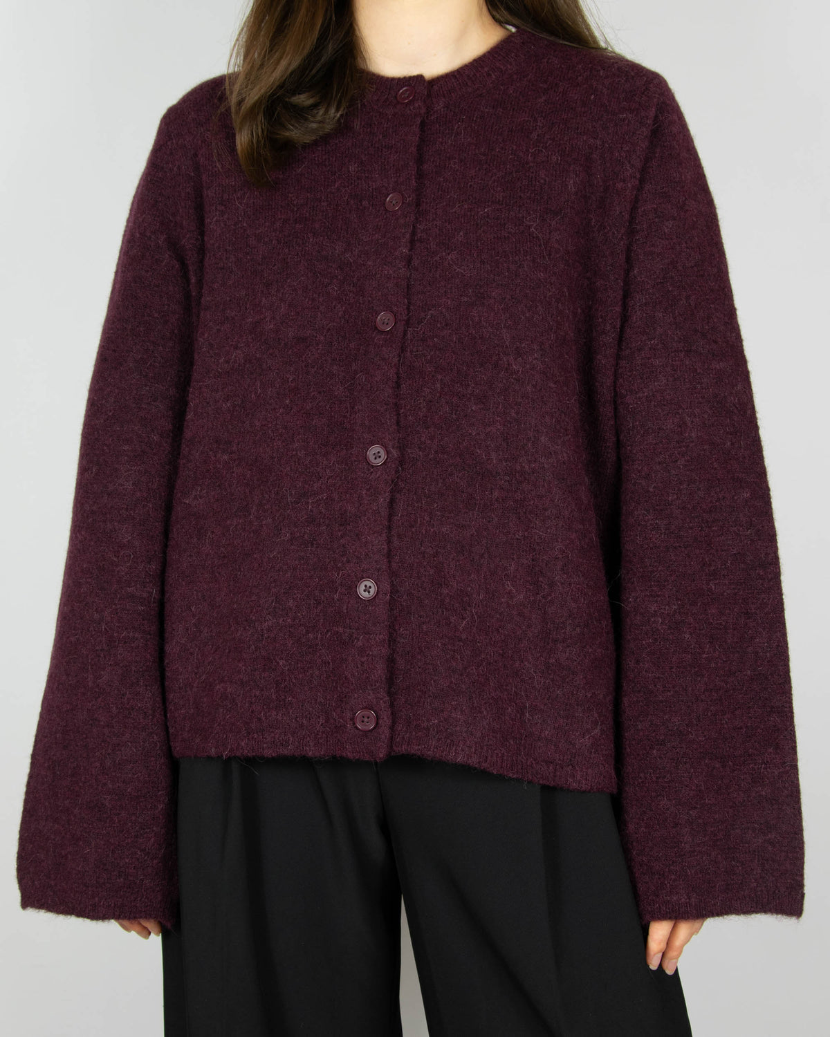 Burgundy wool and alpaca cardigan by Scandinavian brand Selected. The price on the tag is 330 PLN.