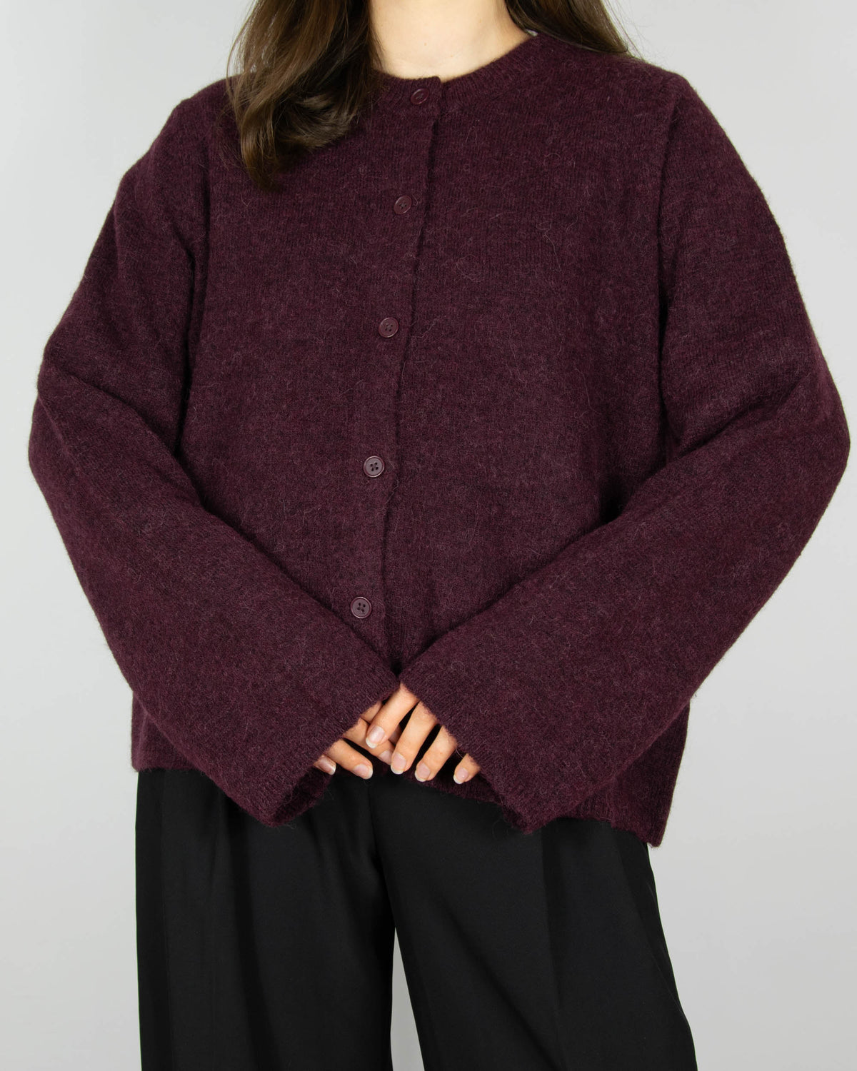 Burgundy wool and alpaca cardigan by Scandinavian brand Selected. The price on the tag is 330 PLN.