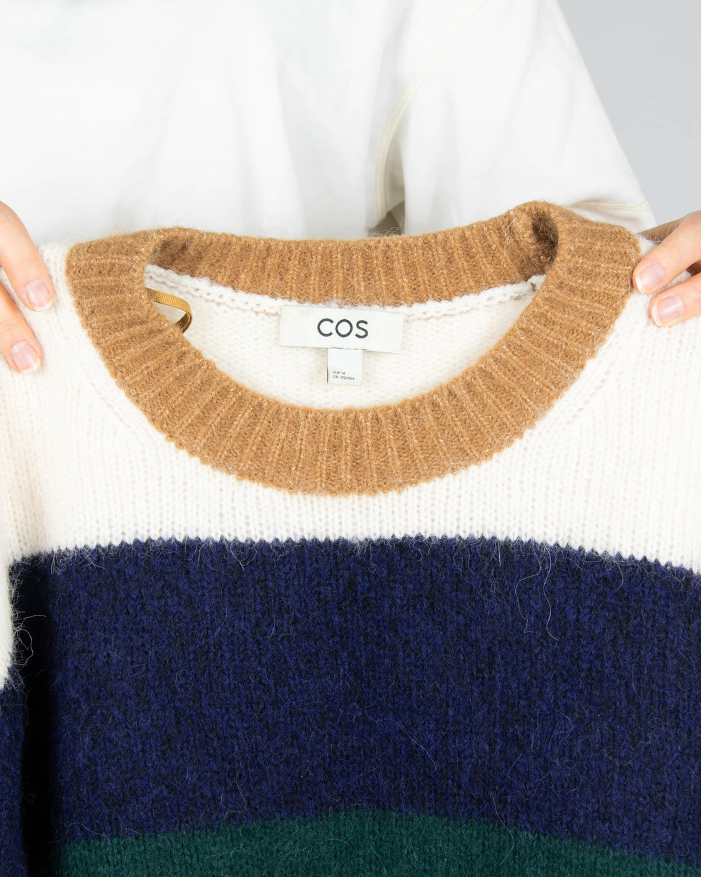 Striped alpaca and wool blend sweater by COS.