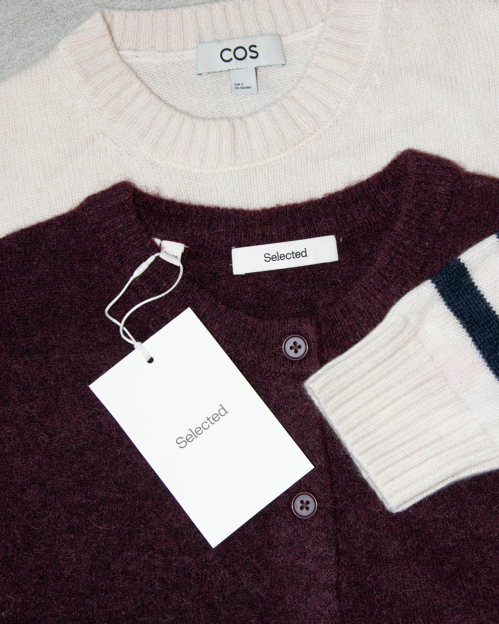 Burgundy wool and alpaca cardigan by Scandinavian brand Selected. The price on the tag is 330 PLN.