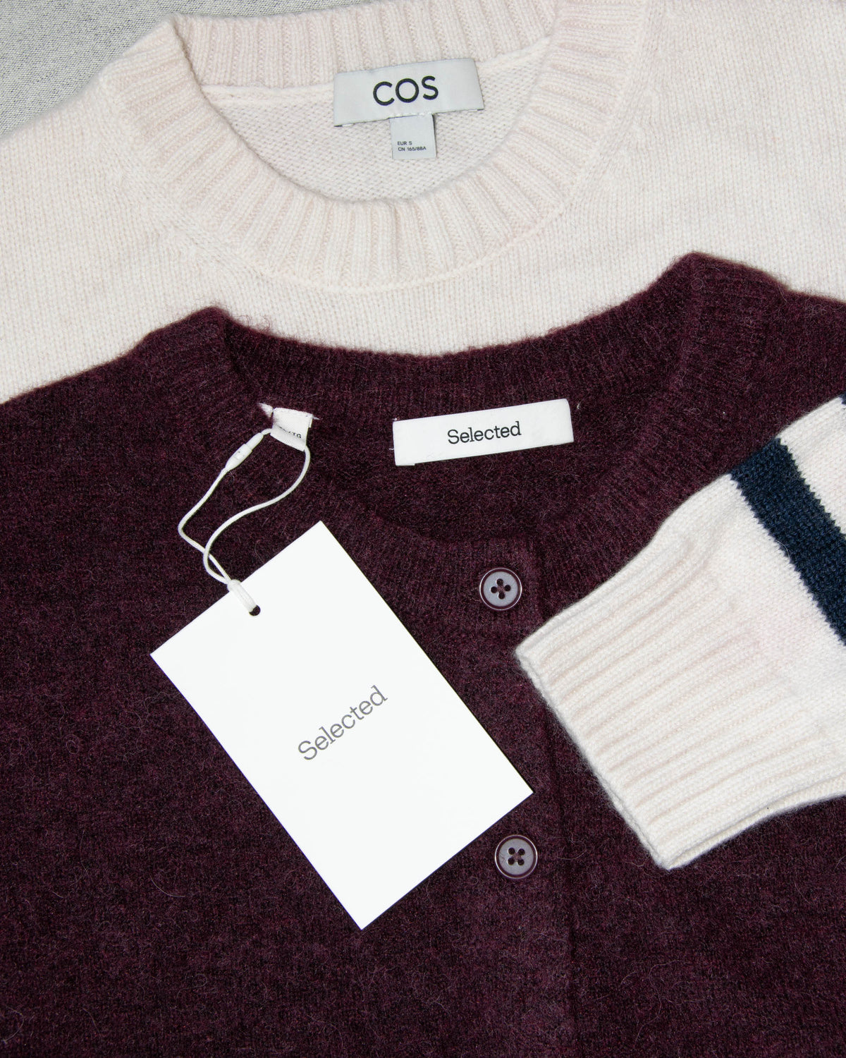 Burgundy wool and alpaca cardigan by Scandinavian brand Selected. The price on the tag is 330 PLN.