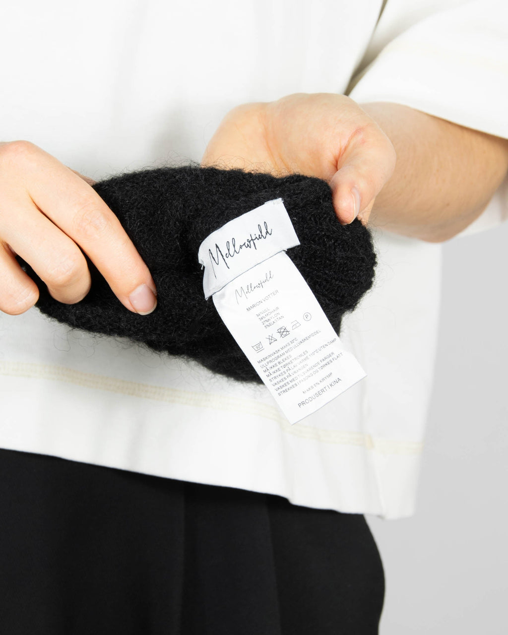 Black long mohair and wool gloves by Scandinavian brand Mellowfield.