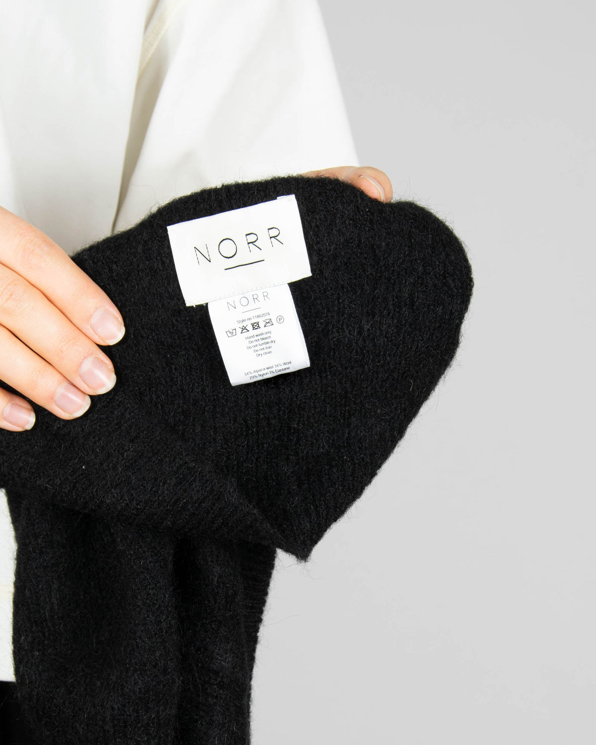 Black alpaca and wool hood by Danish brand NORR.