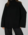 Black chunky merino wool turtleneck sweater by MKDT Studio
