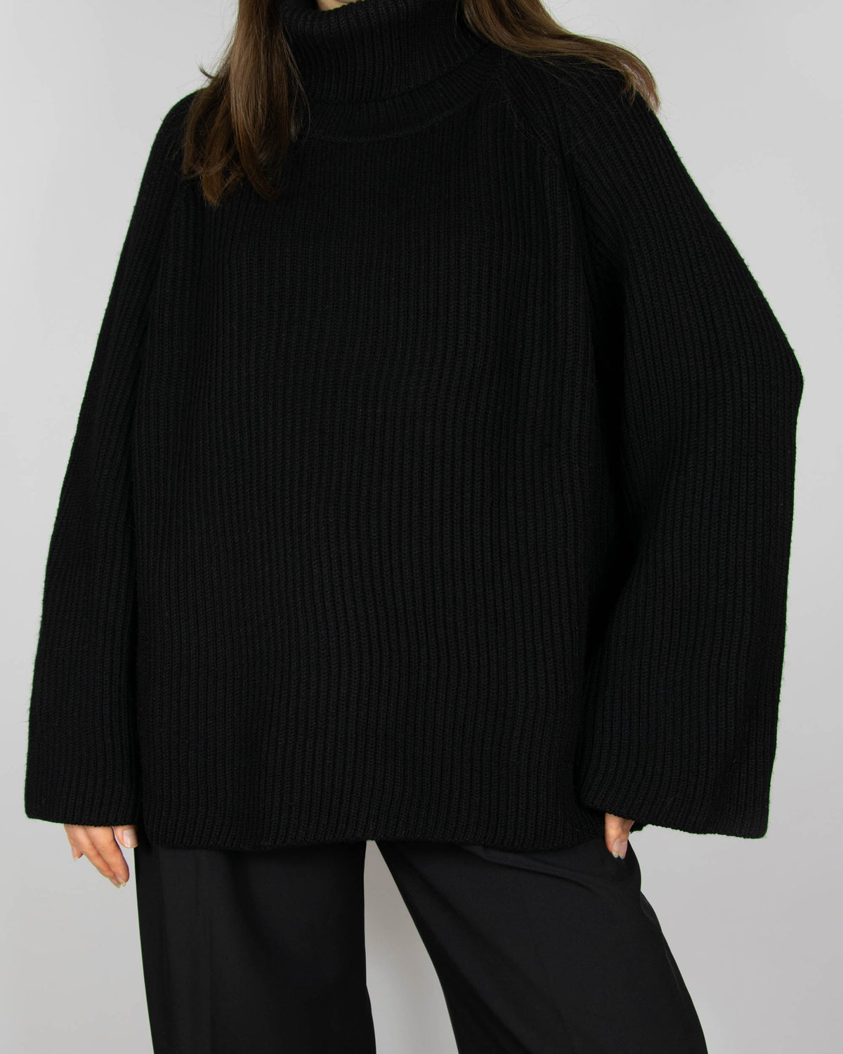 Black chunky merino wool turtleneck sweater by MKDT Studio