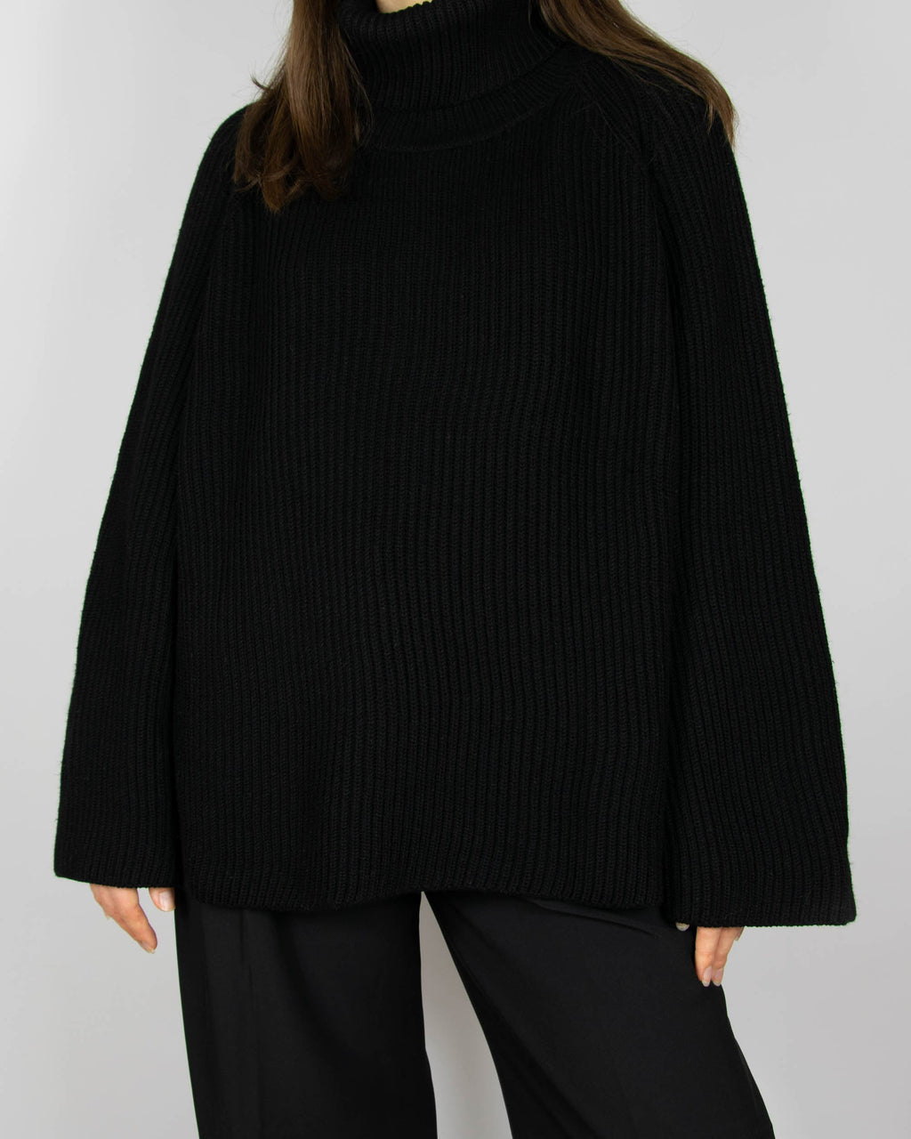 Black chunky merino wool turtleneck sweater by MKDT Studio