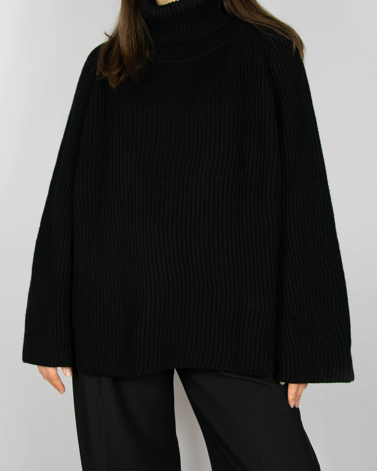 Black chunky merino wool turtleneck sweater by MKDT Studio