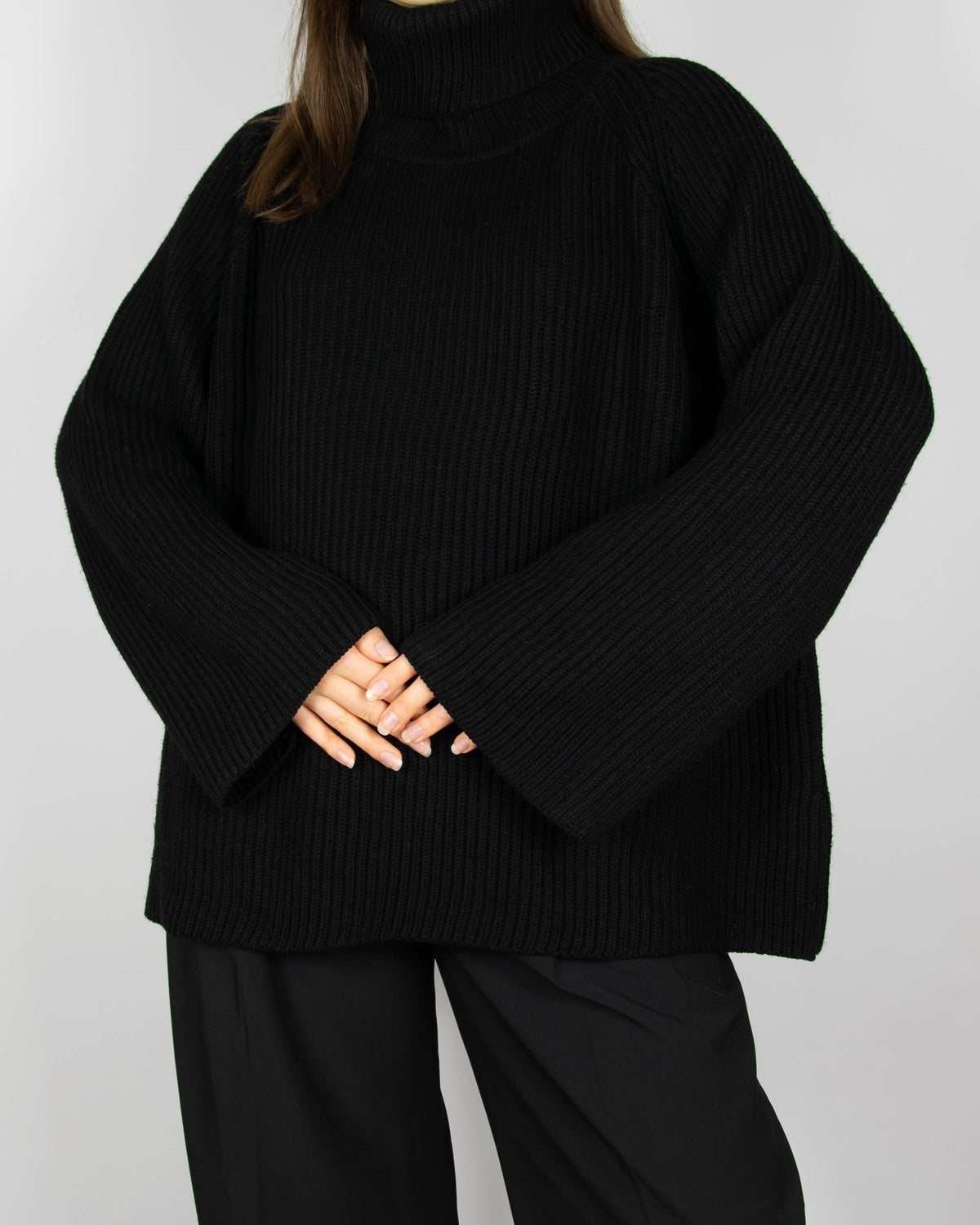 Black chunky merino wool turtleneck sweater by MKDT Studio