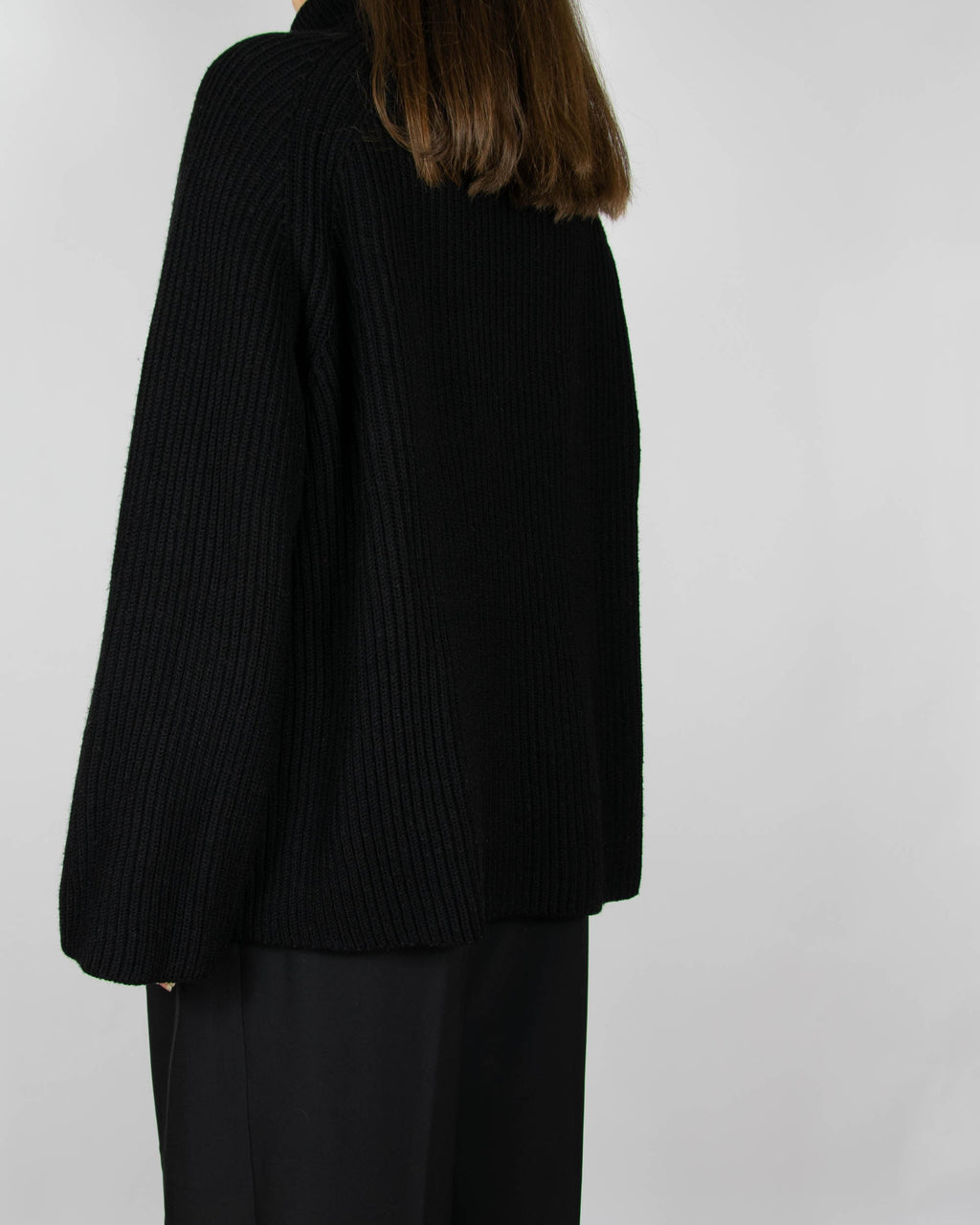 Black chunky merino wool turtleneck sweater by MKDT Studio
