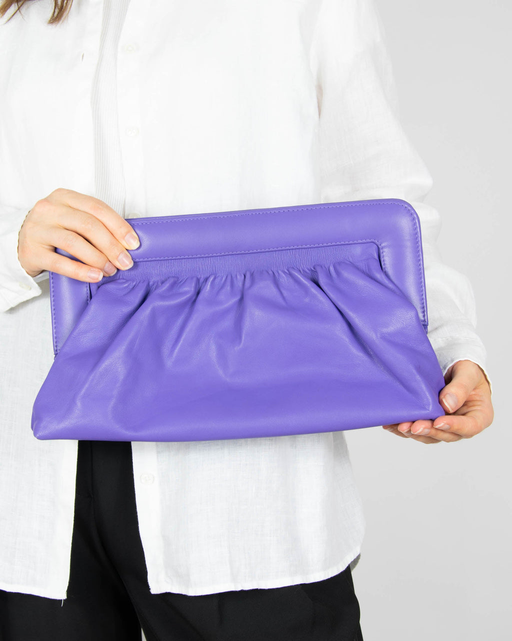 Purple leather clutch bag by GESTUZ