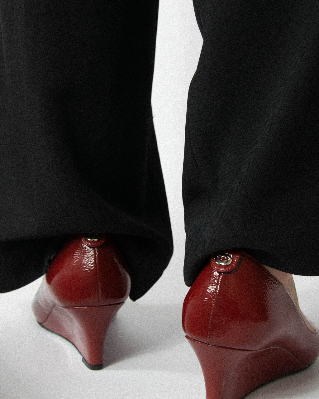 Red leather wedge pumps by Gucci