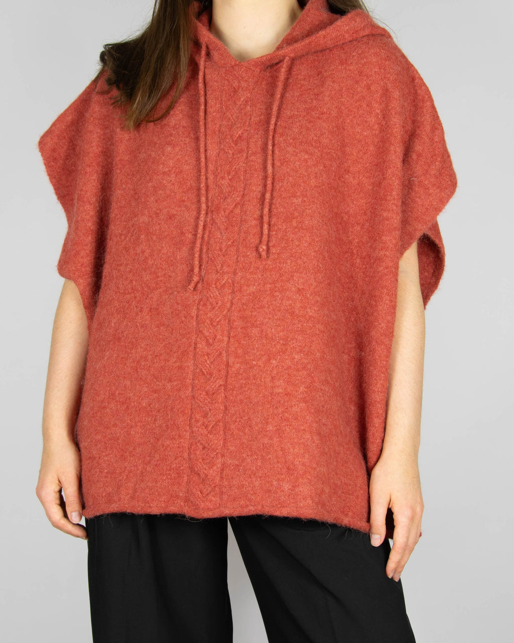 Coral alpaca and merino wool hooded poncho by Scandinavian brand RAH Oslo.