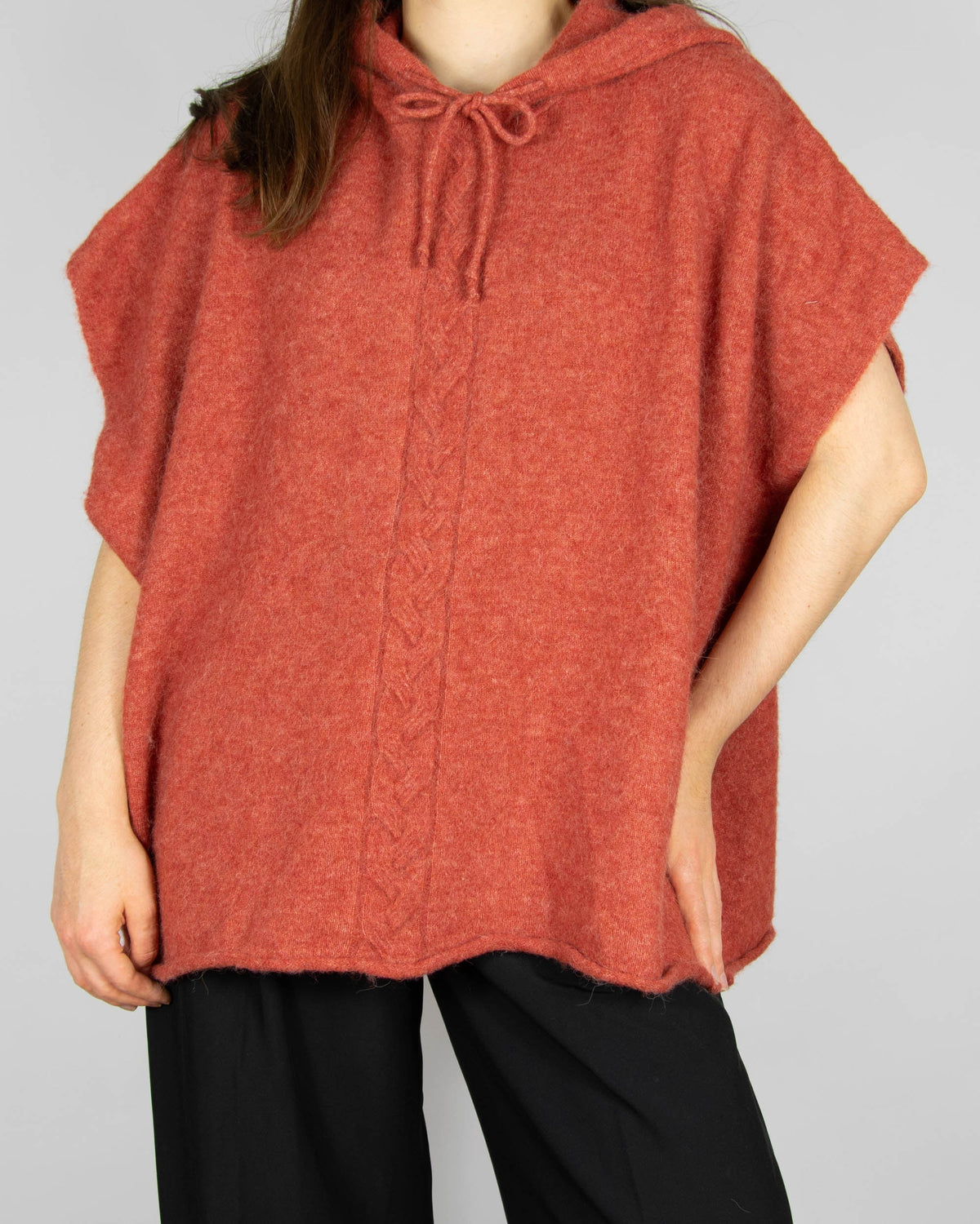 Coral alpaca and merino wool hooded poncho by Scandinavian brand RAH Oslo.