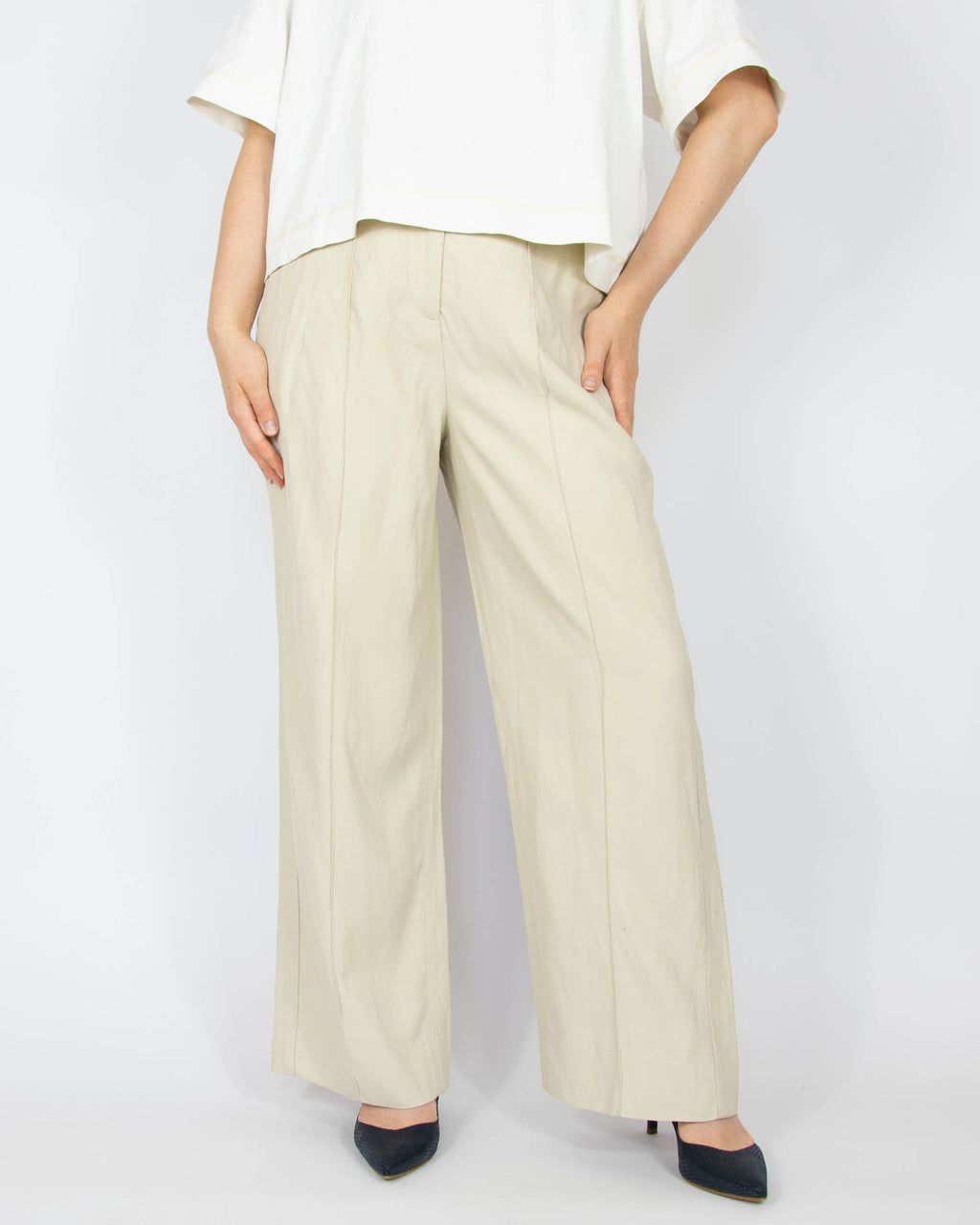 Beige high-waisted, wide-leg viscose and linen trousers by Swedish premium brand Totême