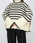 Bestselling cream and black striped wool and organic cotton sweater by Swedish premium brand Totême