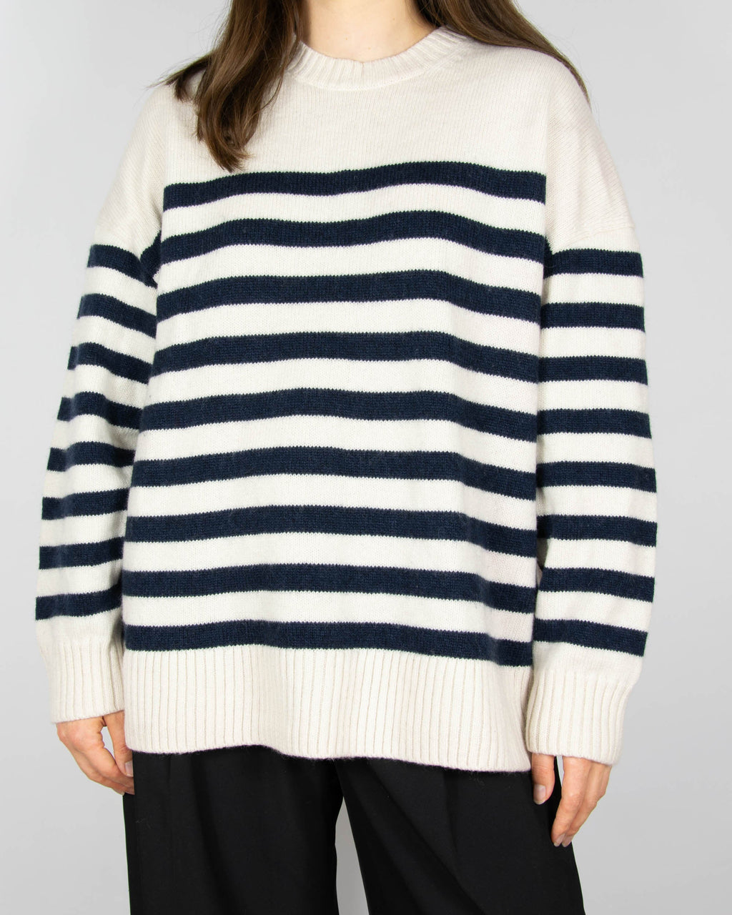 Cream and navy striped wool sweater by COS.