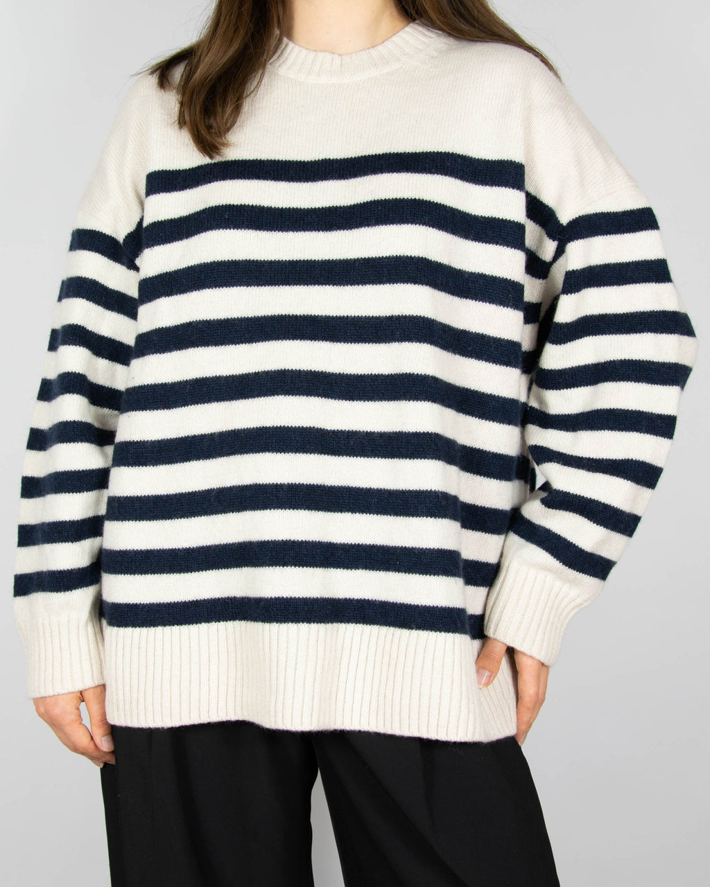 Cream and navy striped wool sweater by COS.