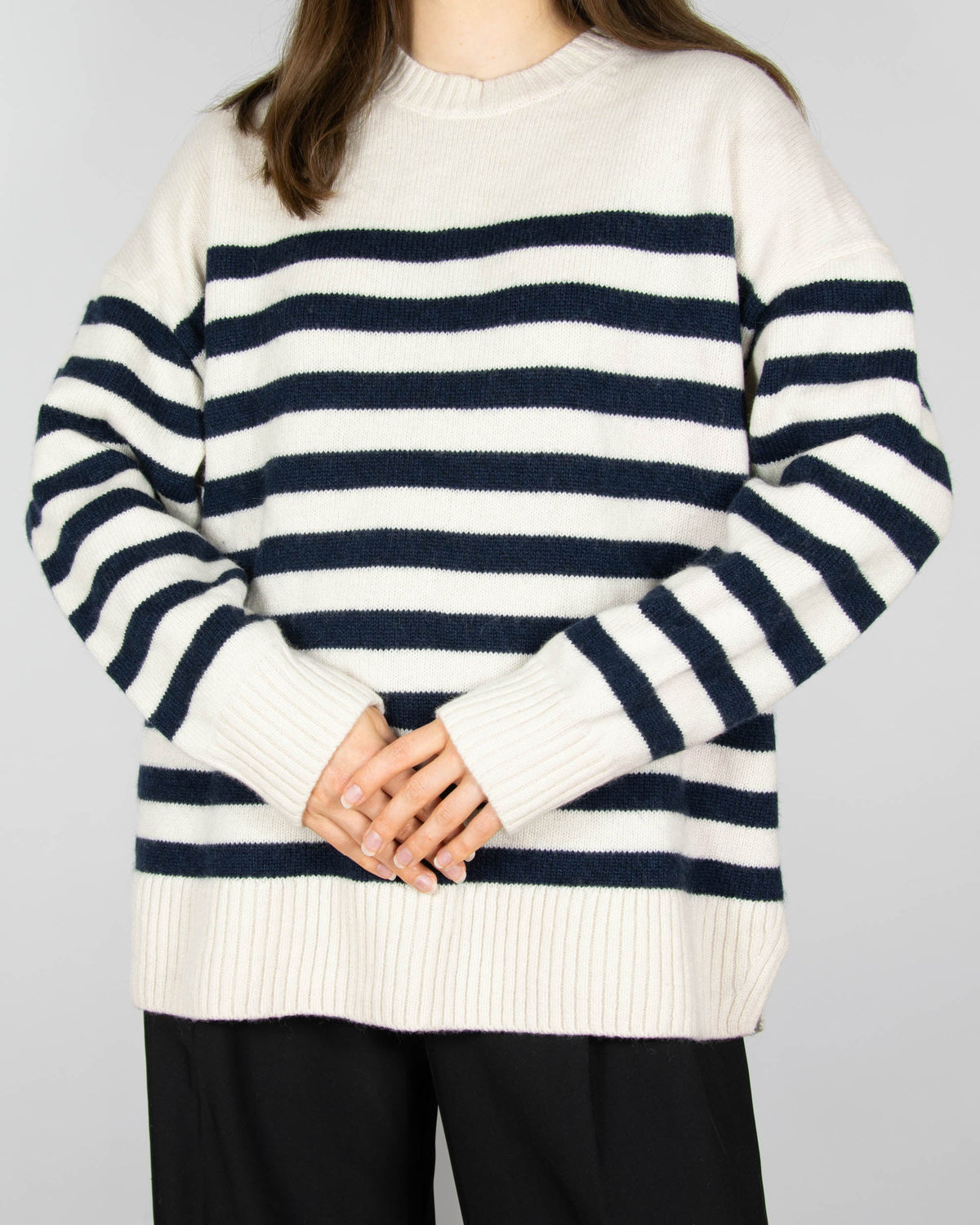 Cream and navy striped wool sweater by COS.