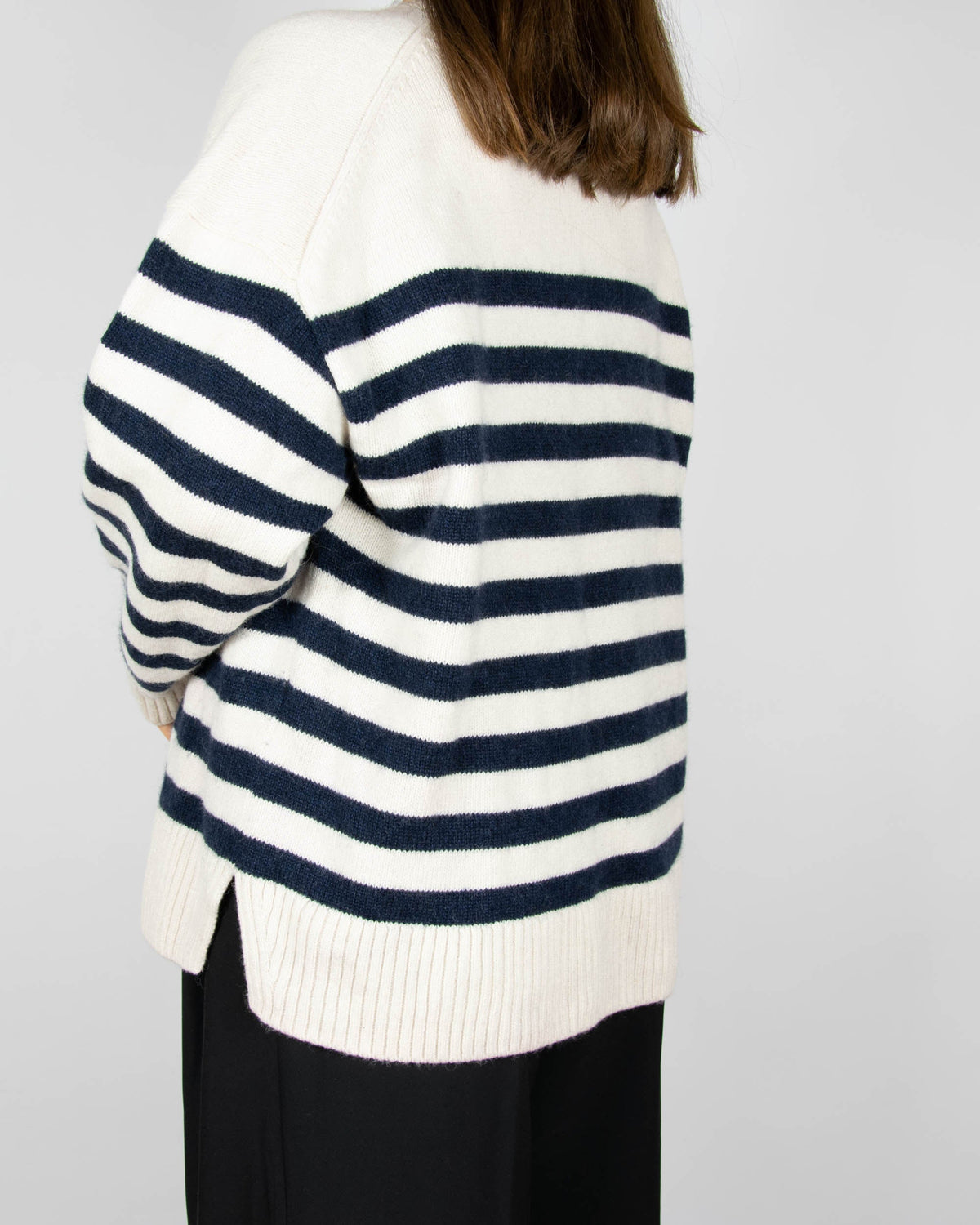 Cream and navy striped wool sweater by COS.