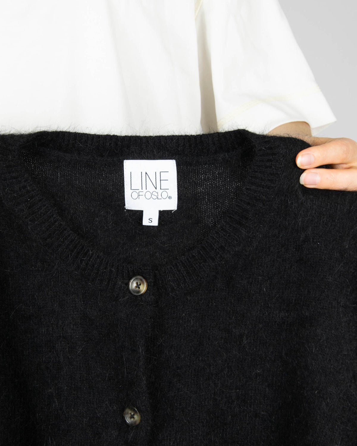 Black angora cardigan by Line of Oslo