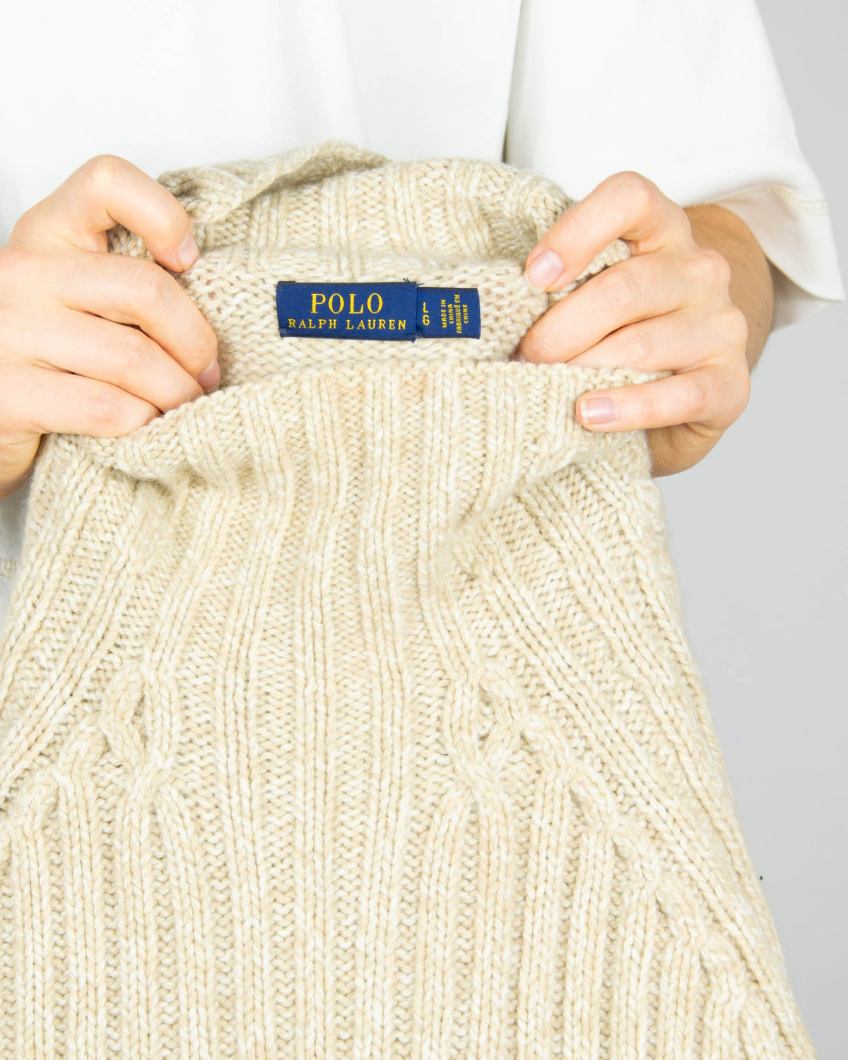Beige chunky wool and cashmere turtleneck sweater by premium brand Ralph Lauren.