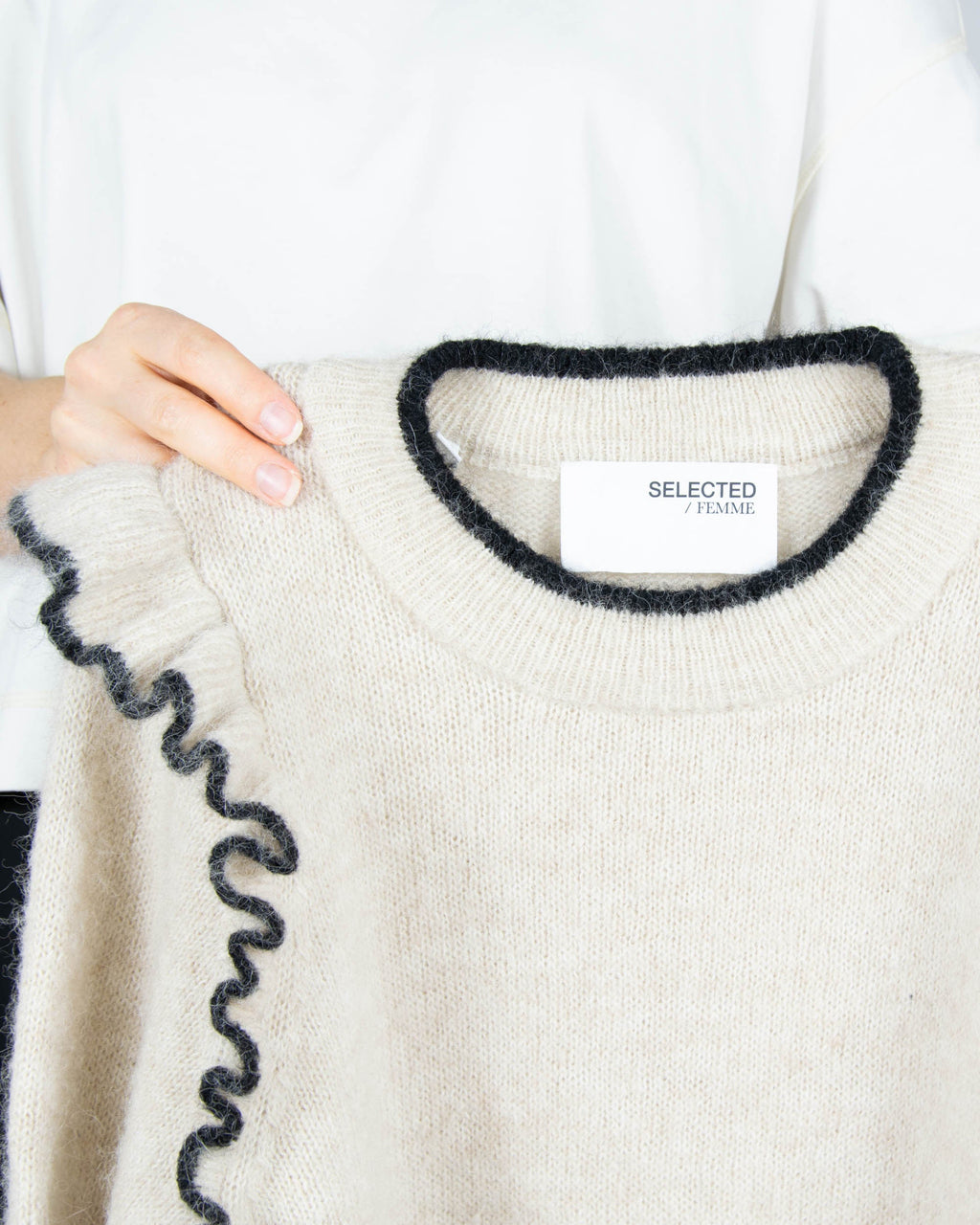 Beige wool and alpaca sweater with ruffle details by Scandinavian brand Selected.