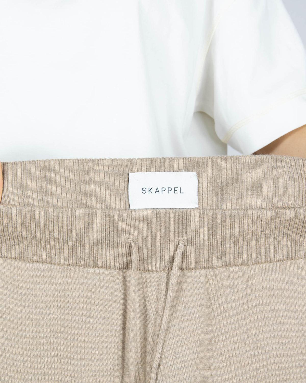 Beige merino wool sweatpants by SKAPPEL.