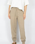 Beige merino wool sweatpants by SKAPPEL.