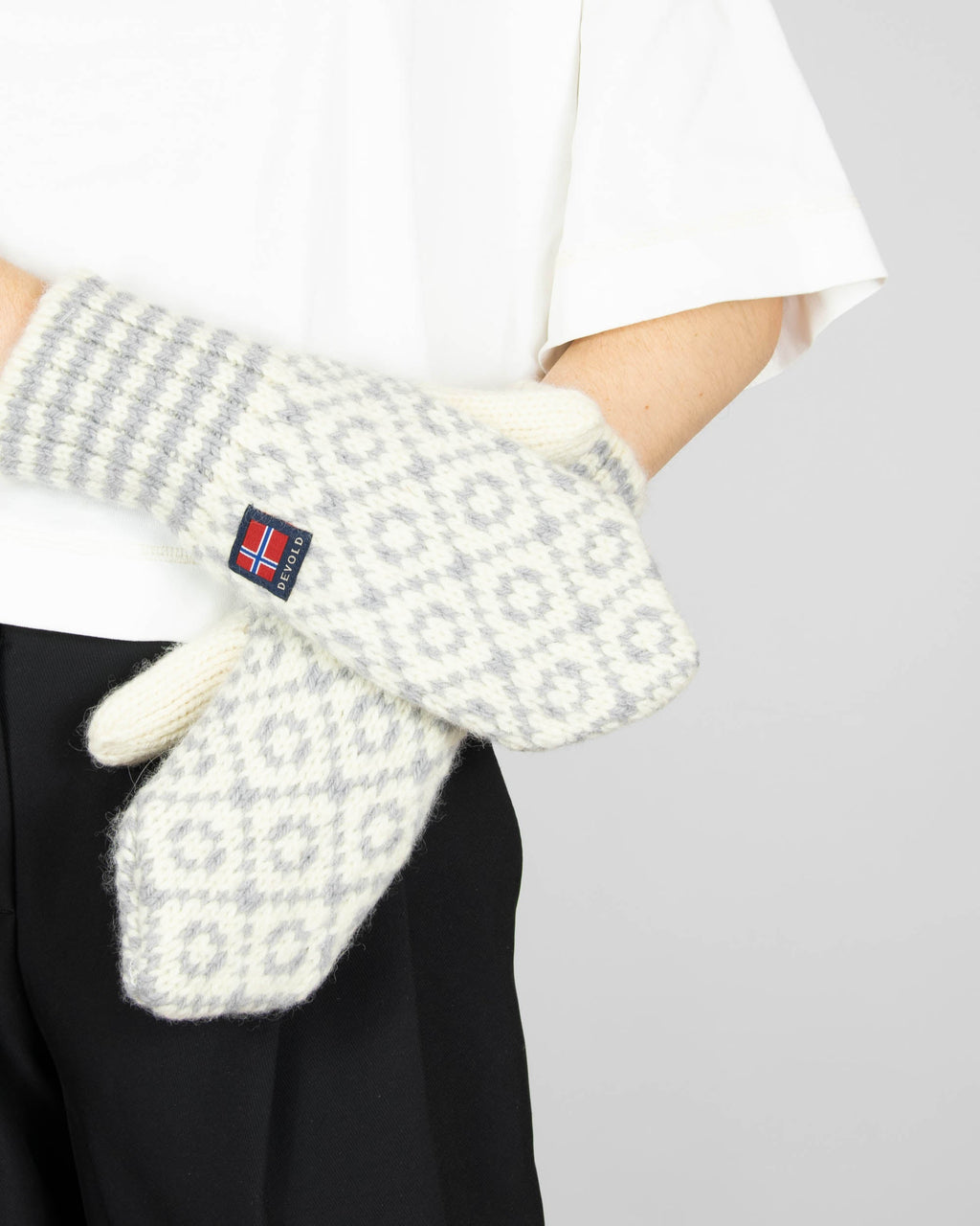 Grey and cream wool gloves by Norwegian brand DEVOLD. From the current collection.