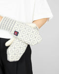 Grey and cream wool gloves by Norwegian brand DEVOLD. From the current collection.