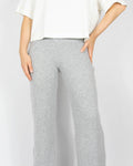 Grey ribbed wide-leg trousers made from wool and cashmere by premium brand Ella & Il. Soft and very pleasant to the touch. The trousers are long and will work especially well for a