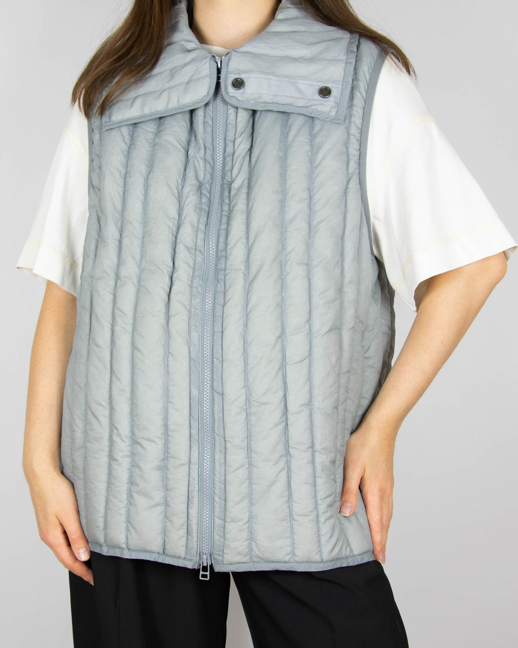 Grey down vest by premium brand Holzweiler. The regular price is €300 (~1300 PLN).
