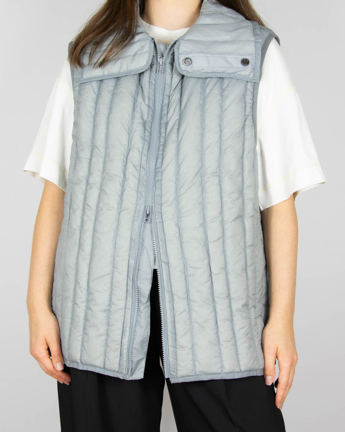 Grey down vest by premium brand Holzweiler. The regular price is €300 (~1300 PLN).