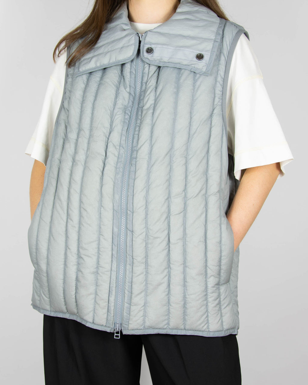 Grey down vest by premium brand Holzweiler. The regular price is €300 (~1300 PLN).
