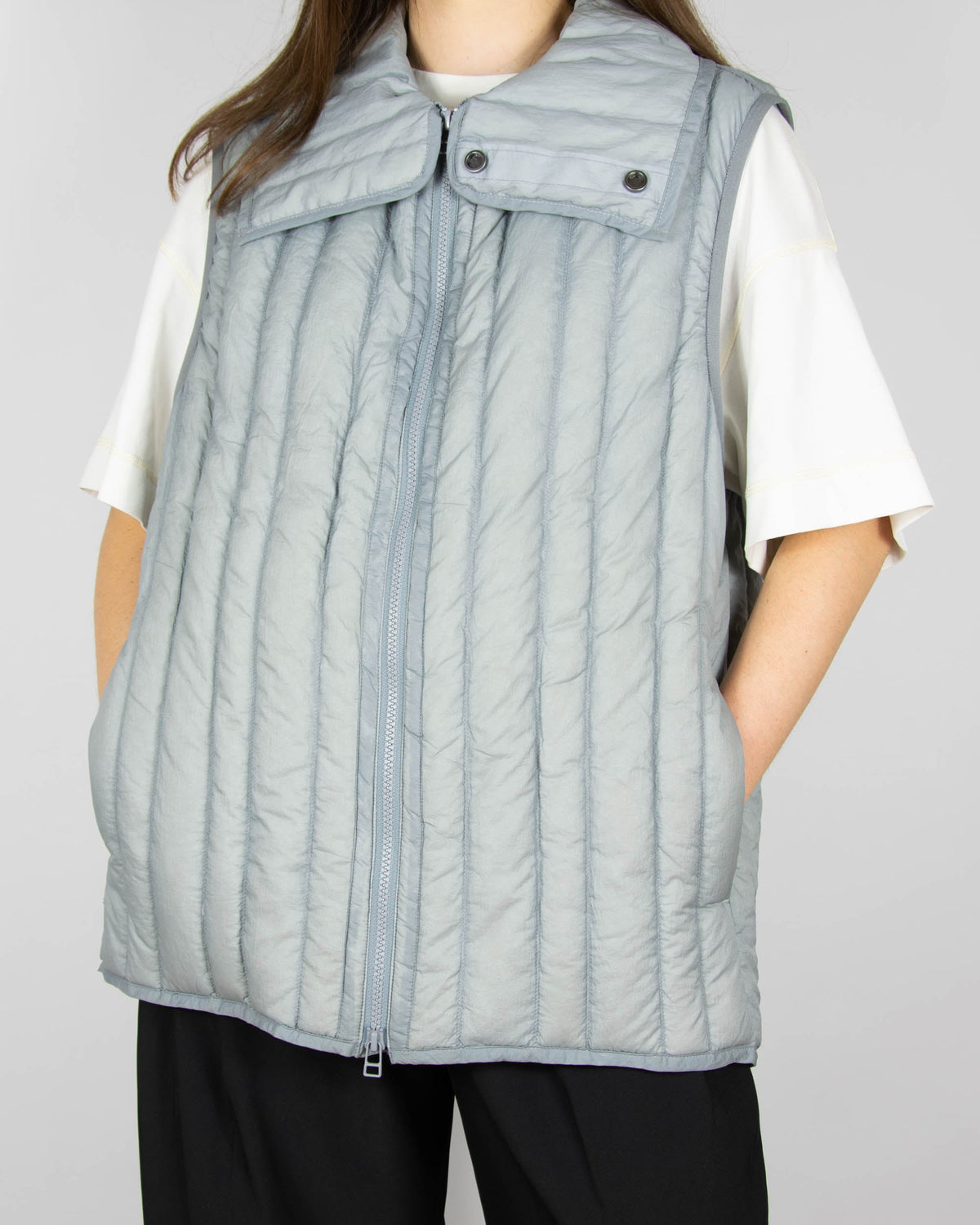 Grey down vest by premium brand Holzweiler. The regular price is €300 (~1300 PLN).