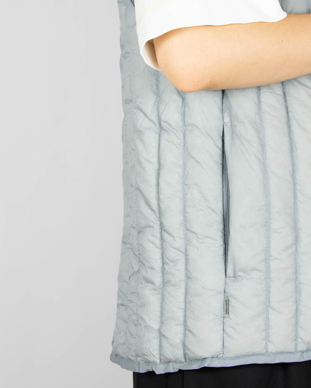 Grey down vest by premium brand Holzweiler. The regular price is €300 (~1300 PLN).