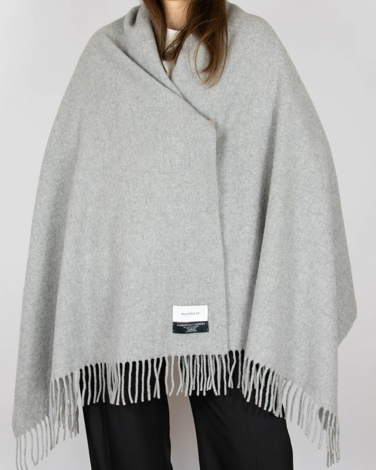 Large, cosy grey lambswool and cashmere scarf by Norwegian designer brand Holzweiler. Made in Italy.